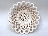 a close up of a white bowl with a decorative design