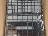 a cardboard box with a metal cage inside of it