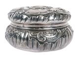 a silver box that is sitting on a white surface