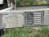 a close up of a metal plate on a trailer