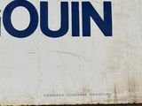 a sign that says gouin on the side of a building
