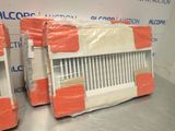 two air conditioners wrapped in plastic on a table