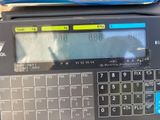 an image of a digital scale with a calculator on top of it