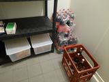 a shelf with bottles of soda and bottles of soda on it