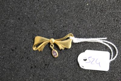 a tag with a bow on it next to a tag with a bow