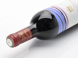 a bottle of wine that is sitting on a table