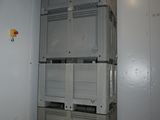 an image of a room with a stack of boxes in it