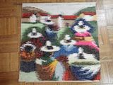 a rug on the floor that has a picture of a group of birds on it