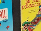 two books are sitting on a shelf next to each other
