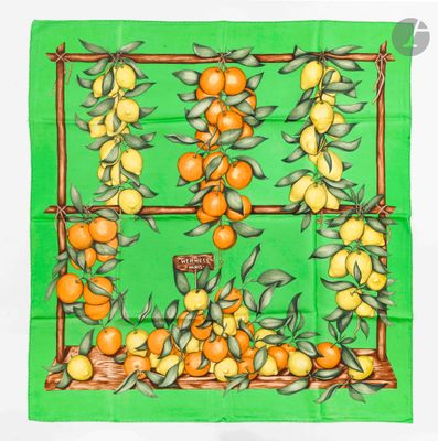 an image of a green scarf with oranges on it