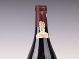 a bottle of wine that is sitting on a table
