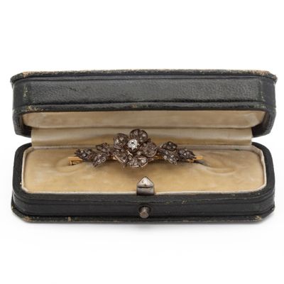 a ring in a case that is sitting on a table