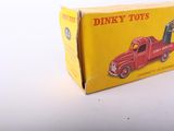 a red toy truck that is sitting in a box