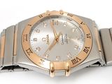 a silver and gold wrist watch with diamonds on it
