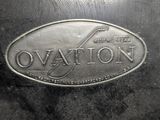 an image of a close up of a metal plate with the word ovation on it
