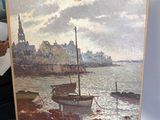 un tableau posé sur un chevalet représentant des bateaux sur l'eau