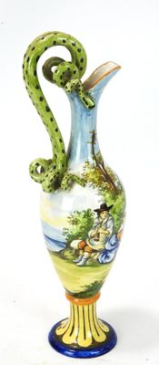 a blue and yellow vase with a green snake on it