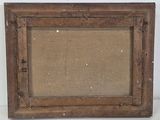 an old picture frame with a picture of a dog in it