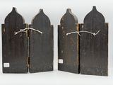 three wooden paddles with a rope tied to them on a white surface