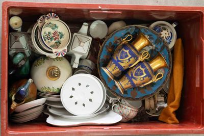 a red box filled with assorted items on a table