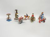 a lot of toy figurines that are sitting on a table