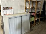 a white cabinet in the middle of a room