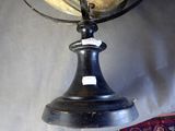 a black and gold globe sitting on top of a table