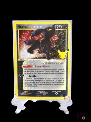 a close up of a pokemon card on a black background