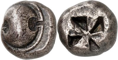 a close up of two metal buttons with a cross on them