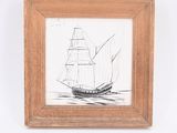 drawing of a sailboat in a wooden frame on a white wall