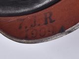 the bottom of a pair of black leather shoes with writing on them