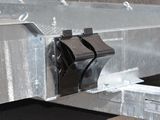a close up of a trailer with a couple of clips attached to it