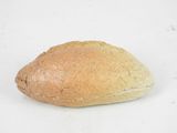 a loaf of bread sitting on a white surface