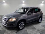 the volkswagen tiguan is parked on a checkered tile floor
