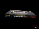 a box with a toy gun in it on a black background