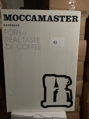 a cardboard box that has a picture of a coffee maker on it