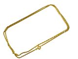 une image d'un collier en or sur fond blanc
