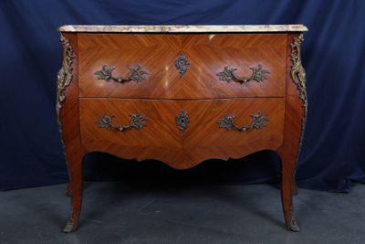 an antique chest of drawers with marble top
