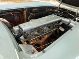 an old car engine in the trunk of it ' s car