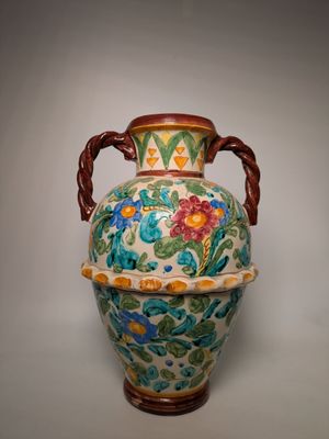 a large vase with a handle on a white background