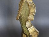 bronze sculpture of a man with a sword on a base
