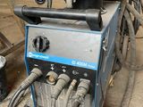 a machine that is sitting on the ground in the garage