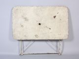 a small white table with a hole in the top