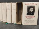 four books in a row with a picture of a man in a suit