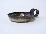 a close up of a small bowl on a white surface
