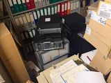 a room full of boxes and files in a storage area