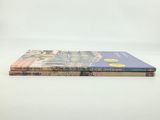 a couple of books sitting on top of each other on a table