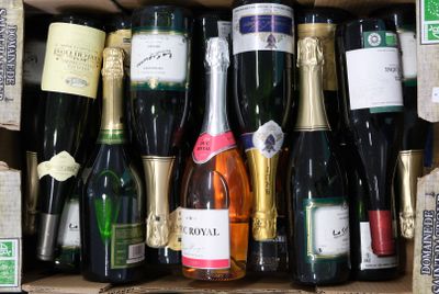 many bottles of wine in a box with labels on them
