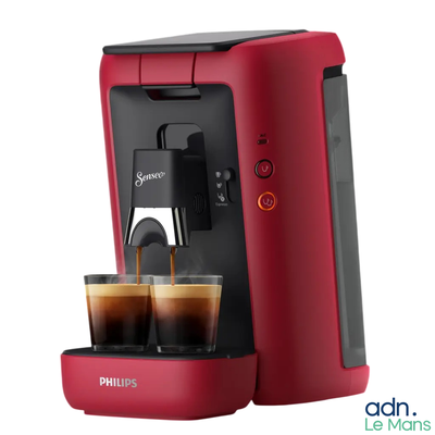 the philips coffee machine is red and has two cups of coffee in it