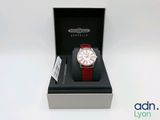 an image of a red and white watch in a black box